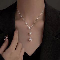 Sterling Silver Pearl Necklaces worn to showcase its length and pendant detail