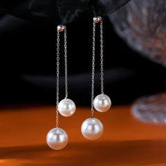 Close-up detail of the sparkling zircons and plating on the Pearl Tassel Earrings