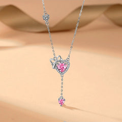 Sterling Silver Pink Diamond Hear Bow Earrings And Necklace Set worn to showcase its length and pendant detail