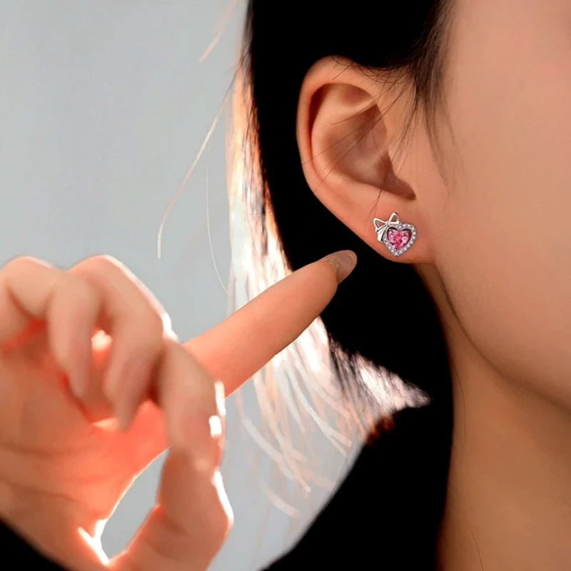 Detailed view of the Sterling Silver Pink Diamond Hear Bow Earrings And Necklace Set chain and pendant