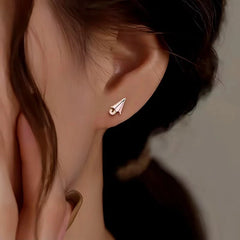 Model showcasing the dangle and style of the Sterling Silver Pink Small Umbrella Stud Earrings