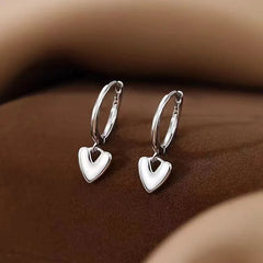 Angled view of the Sterling Silver Polished Heart Earrings