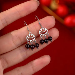 Close-up detail of the sparkling zircons and plating on the Tassel Threader Earrings