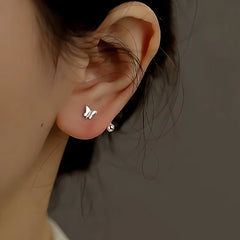 Close-up detail of the sparkling zircons and plating on the Screw Back Butterfly Studs