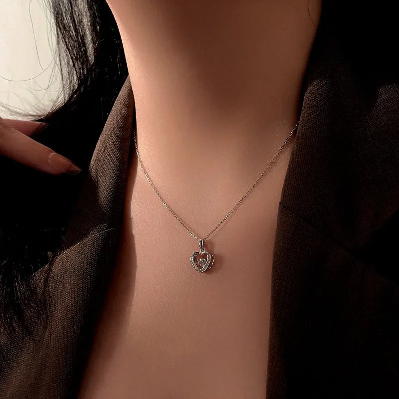 Sterling Silver Simple Beating Heart Necklace worn to showcase its length and pendant detail