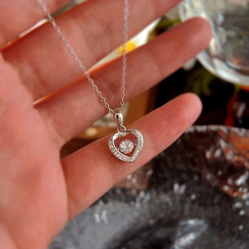 Detailed view of the Sterling Silver Simple Beating Heart Necklace chain and pendant
