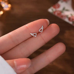 Angled view of the Sterling Silver Small Wing Screw Earrings