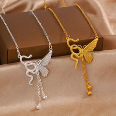 Sterling Silver Snake And Butterfly Tassel Necklace worn to showcase its length and pendant detail