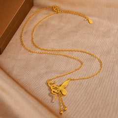 Detailed view of the Sterling Silver Snake And Butterfly Tassel Necklace chain and pendant