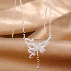 Close-up of the pendant and clasp on the Snake Butterfly Necklace