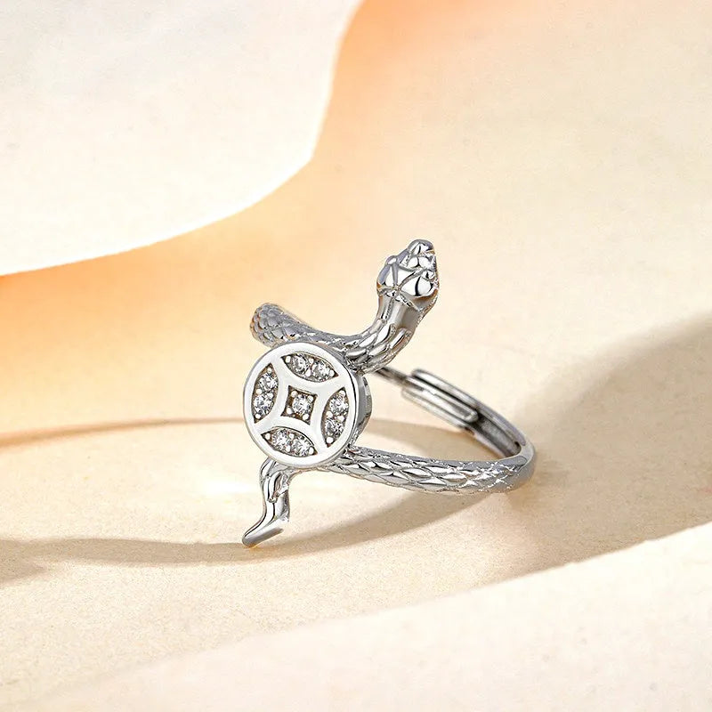 Close-up view of the gemstone and setting of the Rotating Snake Ring