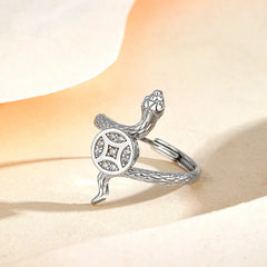 Close-up view of the gemstone and setting of the Rotating Snake Ring