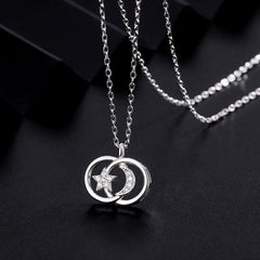 Sterling Silver Star And Moon Necklaces worn to showcase its length and pendant detail
