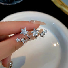 Angled view of the Sterling Silver Star And Pearl Studs