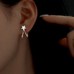 Model showcasing the dangle and style of the Sterling Silver Star Ear Clips ( 1 Pair )