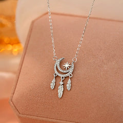 Sterling Silver Star Moon Feather Necklace worn to showcase its length and pendant detail