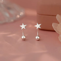 Model showcasing the dangle and style of the Sterling Silver Star Screw Earrings