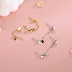 Model showcasing the dangle and style of the Sterling Silver Star Tassel Earrings