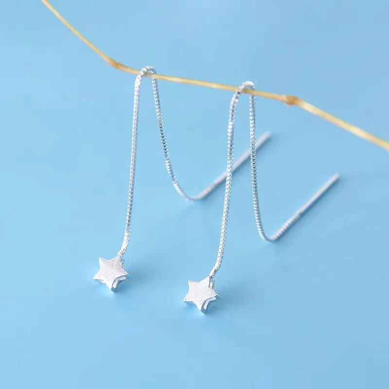 Close-up detail of the sparkling zircons and plating on the Star Threader Earrings