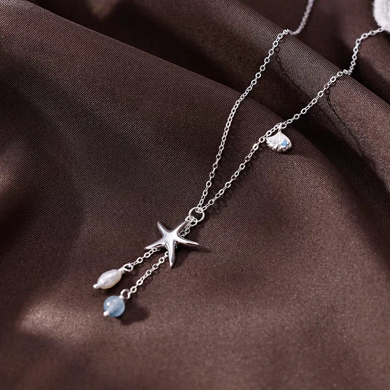 Detailed view of the Sterling Silver Starfish Shell Natural Pearl Necklace chain and pendant