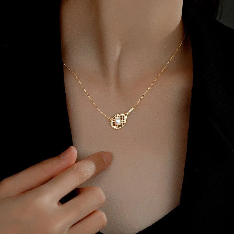 Sterling Silver Tennis Racket Pearl Necklaces worn to showcase its length and pendant detail
