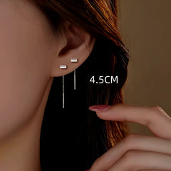 Model showcasing the dangle and style of the Sterling Silver Threader Earrings