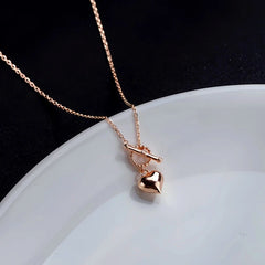 Sterling Silver Three-Dimensional Love Heart Necklaces worn to showcase its length and pendant detail