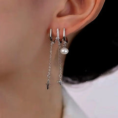Close-up detail of the sparkling zircons and plating on the Pearl Star Tassel Earrings