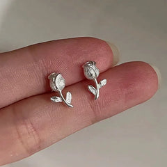 Model showcasing the dangle and style of the Sterling Silver Tulip Stud Earrings
