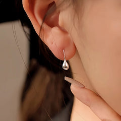 Model showcasing the dangle and style of the Sterling Silver Water Drop Ear Hook Earrings