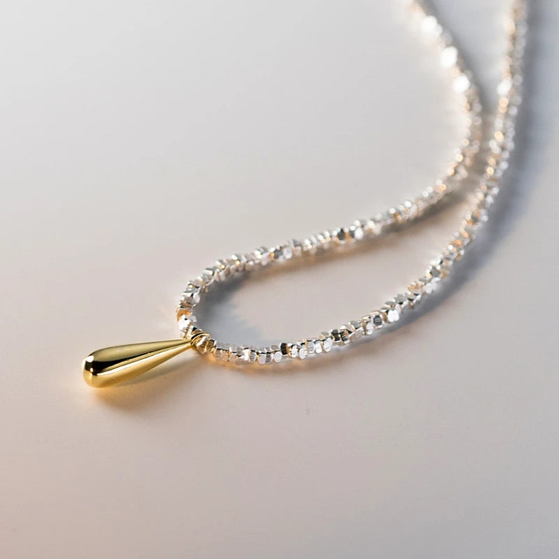 Detailed view of the Sterling Silver Water Drop Earrings chain and pendant