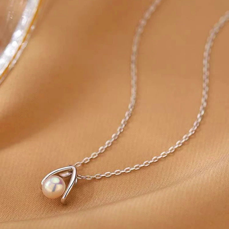Sterling Silver Water Drop Split Pearl Necklaces worn to showcase its length and pendant detail
