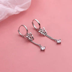 Model showcasing the dangle and style of the Sterling Silver ZIrcon Butterfly Tassel Earrings