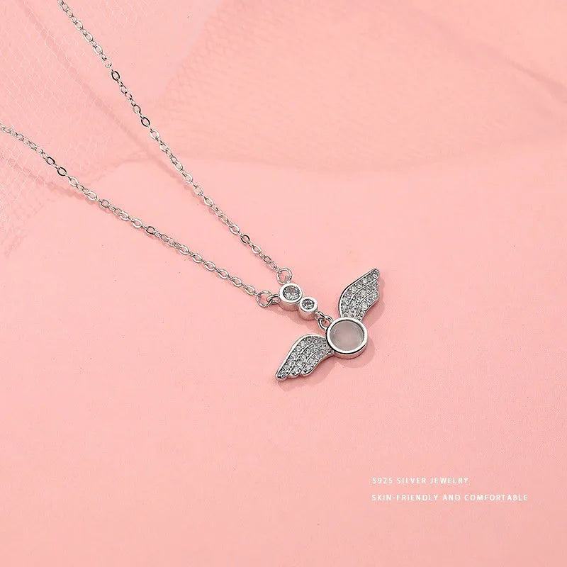 Close-up of the pendant and clasp on the Zircon Angel Wing Necklace