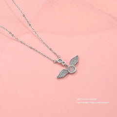 Close-up of the pendant and clasp on the Zircon Angel Wing Necklace