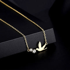 Close-up of the pendant and clasp on the Zircon Bird Necklace