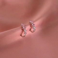 Close-up detail of the sparkling zircons and plating on the C-Shaped Hoop Earrings