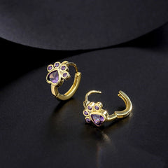 Model showcasing the dangle and style of the Sterling Silver Zircon Cute Pet Hoop Earrings