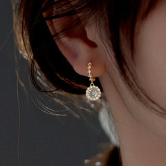 Close-up detail of the sparkling zircons and plating on the Zircon Tassel Earrings