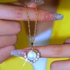 Close-up of the pendant and clasp on the Pearl Chain Necklace