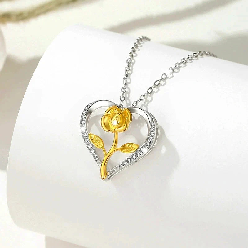Close-up of the pendant and clasp on the Heart Flower Necklace