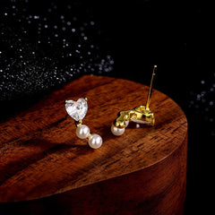 Close-up detail of the sparkling zircons and plating on the Heart Pearl Studs