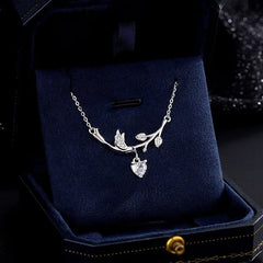 Sterling Silver Zircon Heart Leaf Earrings worn to showcase its length and pendant detail