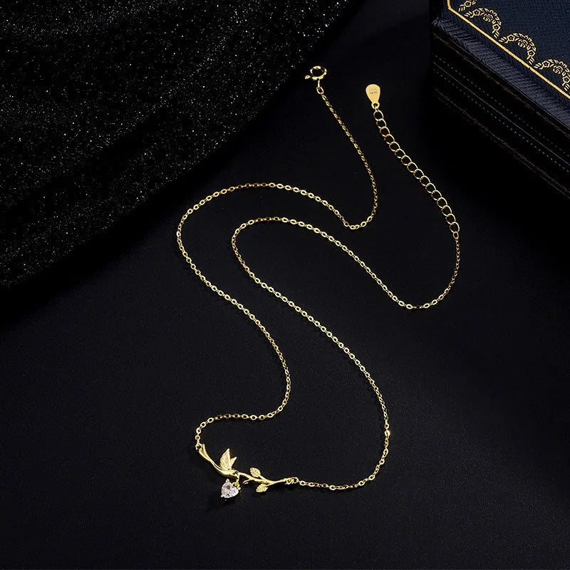 Detailed view of the Sterling Silver Zircon Heart Leaf Earrings chain and pendant