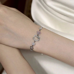 Model wearing the Sterling Silver Zircon Hello Kitty Bracelet to highlight its design on the wrist