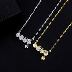 Close-up of the pendant and clasp on the LOVE Letter Necklace