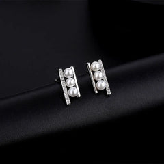 Close-up detail of the sparkling zircons and plating on the Zircon Pearl Studs