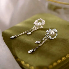 Angled view of the Sterling Silver Zircon Pearl Tassel Earrings