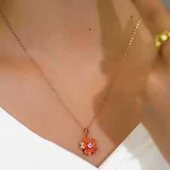 Close-up of the pendant and clasp on the Rotating Blossom Necklace