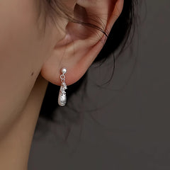 Close-up detail of the sparkling zircons and plating on the Water Drop Earrings